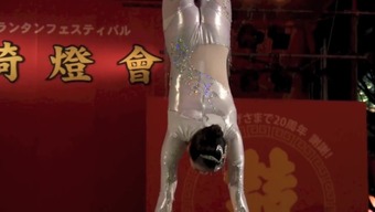 GORGEOUS CHINESE GIRL PERFORMING DEATH DEFYING STUNT
