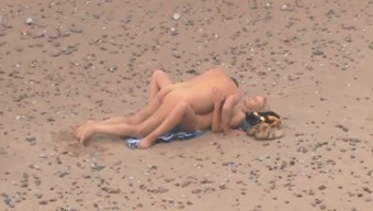 Mature grey haired chubby dude was fucking his blonde wife on the beach
