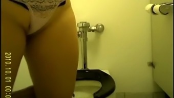 Women caught in toilet by spy camera