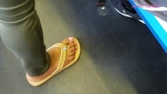 Candid ebony feet in sandals pink toes