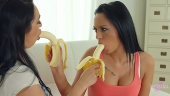 Two brunettes switch from eating bananas to licking wet pussies instead