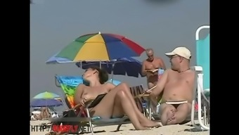 A lovely chick in a nude beach spy cam video