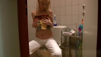 Blonde hottie loves to masturbate in the bathroom