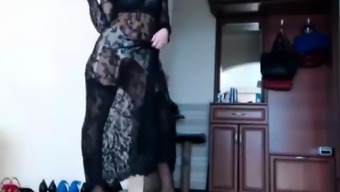 Slender brunette in stockings and high heels fucks herself