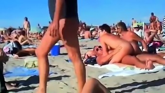 Amateur swingers enjoying hardcore group sex on the beach