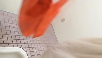 Asian peeing in toilet