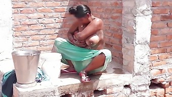 Indian bhabhi gets dirty on her rooftop with fingers and big nipples