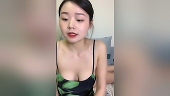 Cute Asian girl with big natural tits on webcam